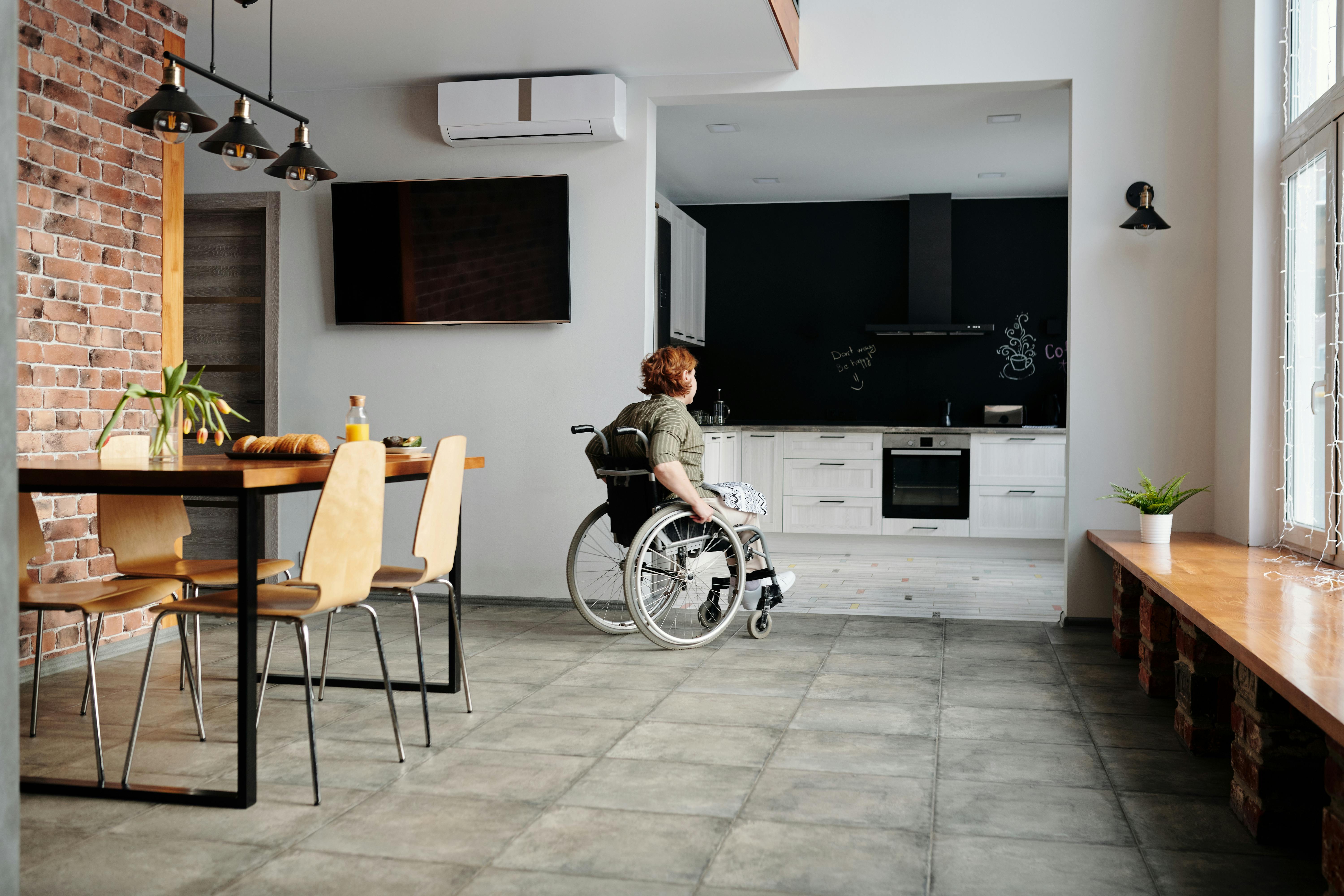 woman moving through her house in a wheelchair